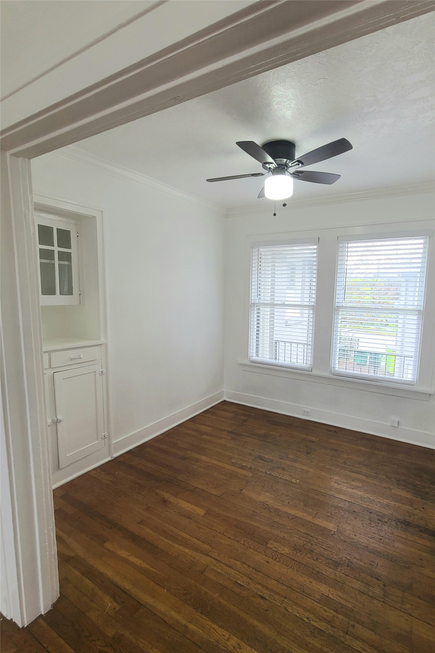 4414 Woodside Street, Unit 8 Houston, TX 77023 - Photo 5 of 14 a view of empty room with wooden floor and fan