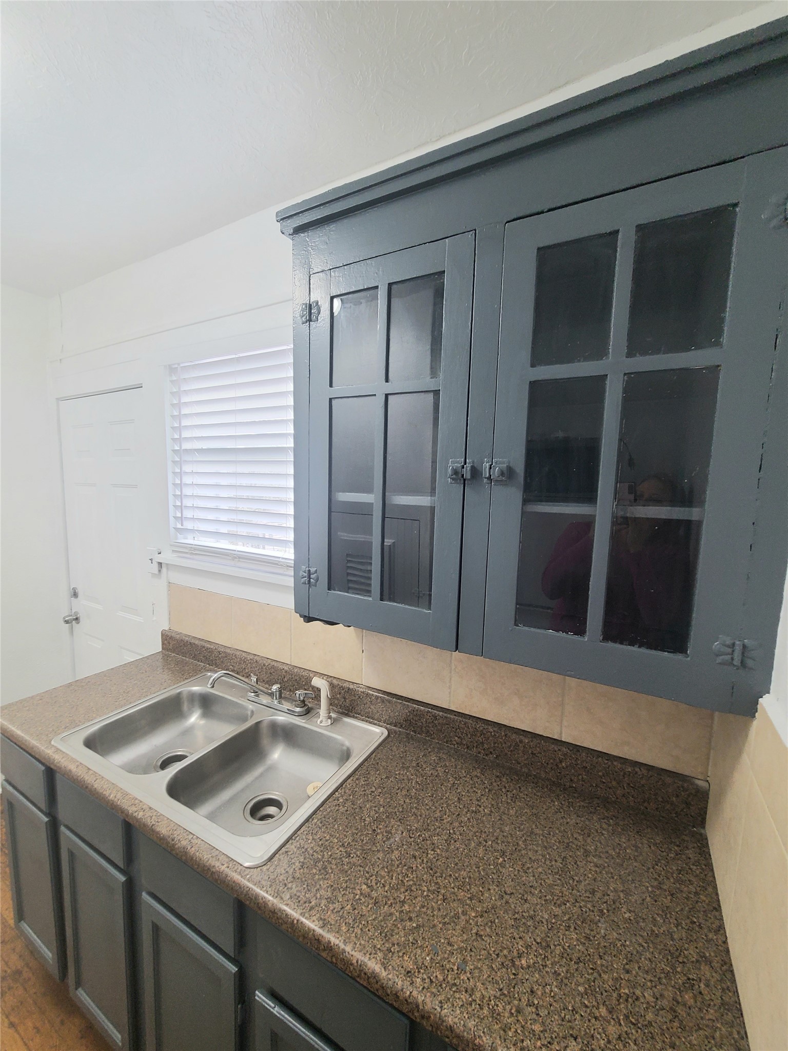 4414 Woodside Street, Unit 8 Houston, TX 77023 - Photo 7 of 14 a kitchen with a sink stove and cabinets