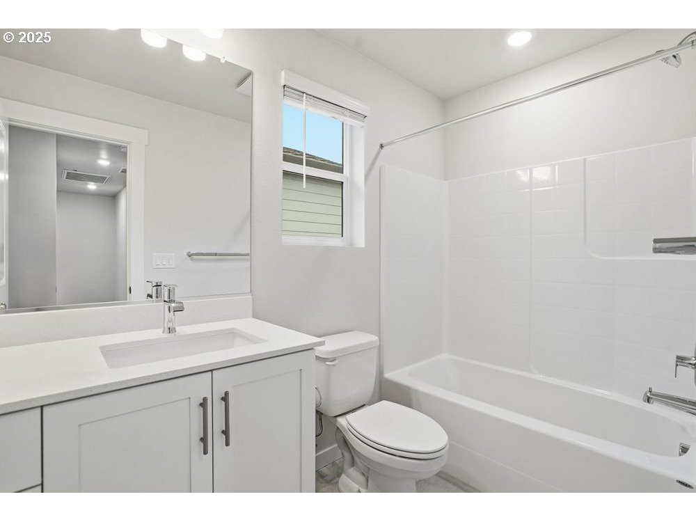 3739 Southwest 40th Street Gresham, OR 97080 - Photo 11 of 11 a bathroom with a sink toilet a mirror and shower