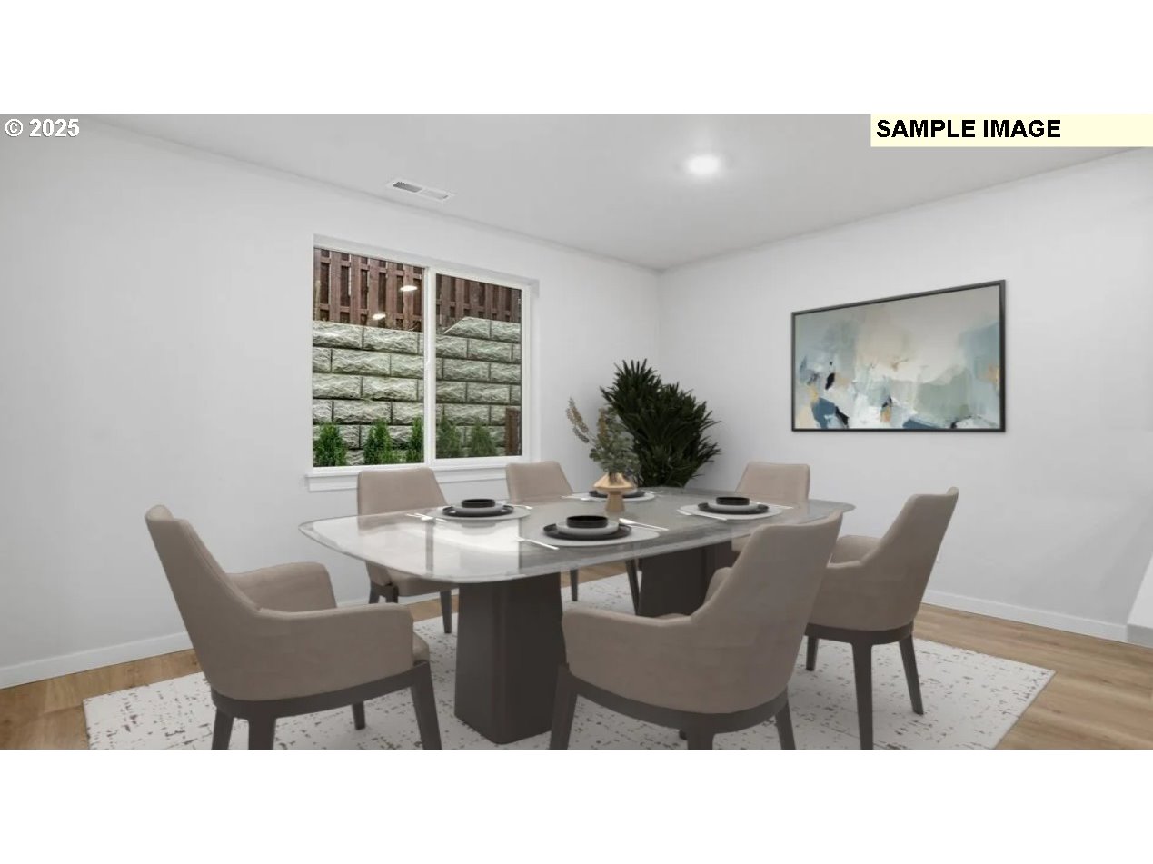 3739 Southwest 40th Street Gresham, OR 97080 - Photo 7 of 11 a kitchen with a table and chairs in it