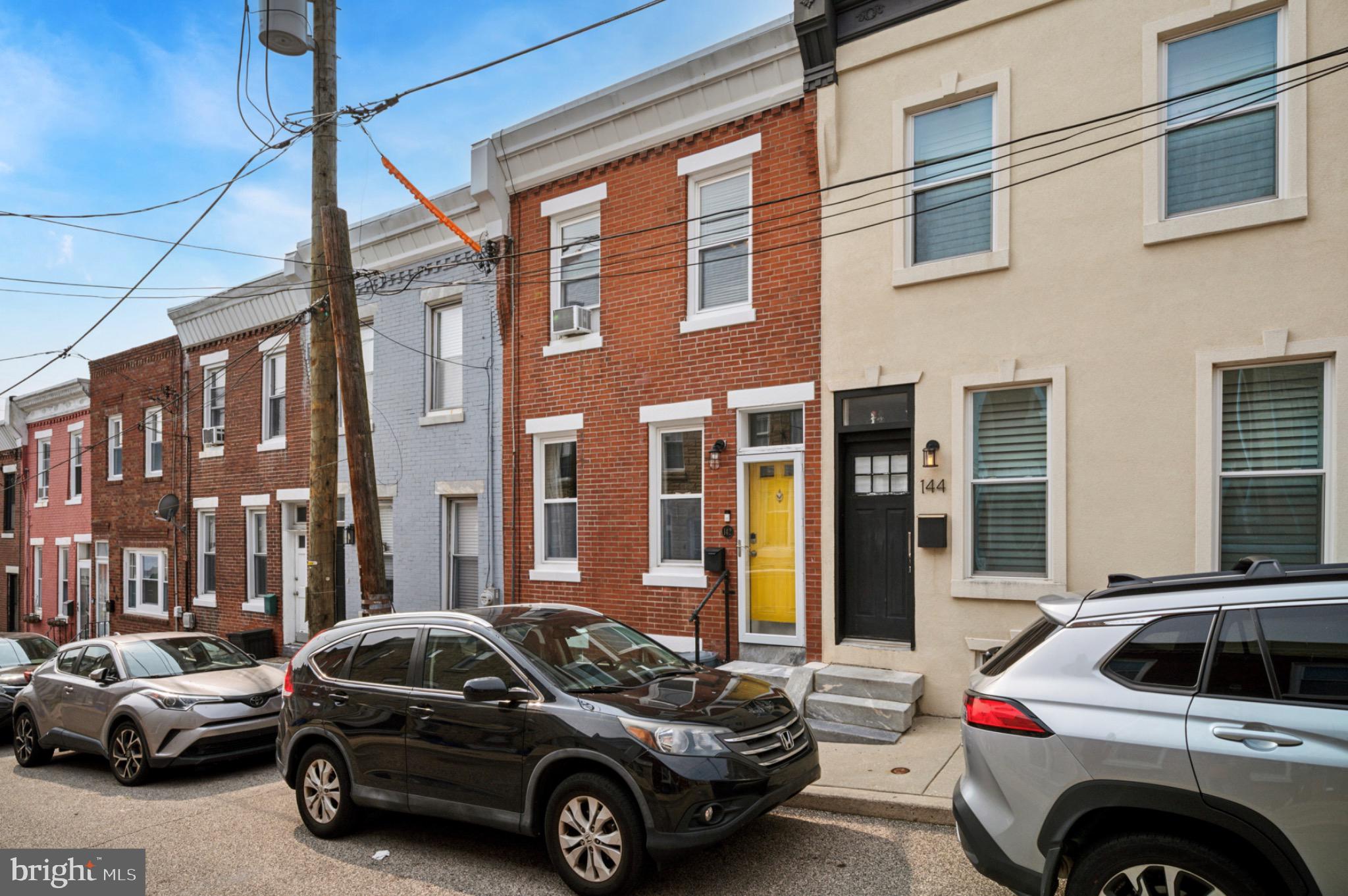 a view of a car parked in front of a building