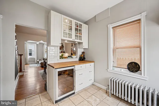 a kitchen with a stove a sink and a refrigerator