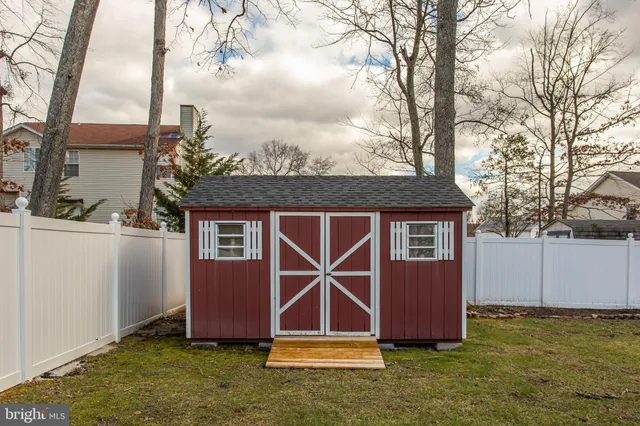 a backyard of a house with a yard and garage