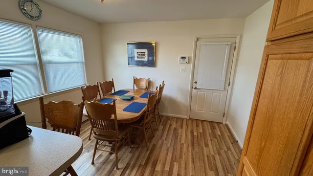 a view of a house with a yard and garden