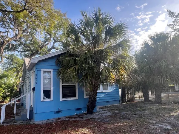 a view of a house with a tree