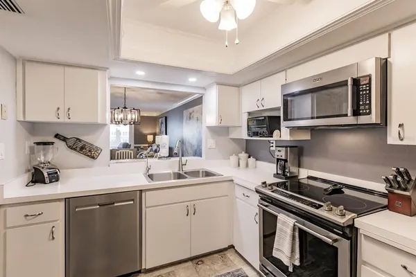 a kitchen with a stove and a sink