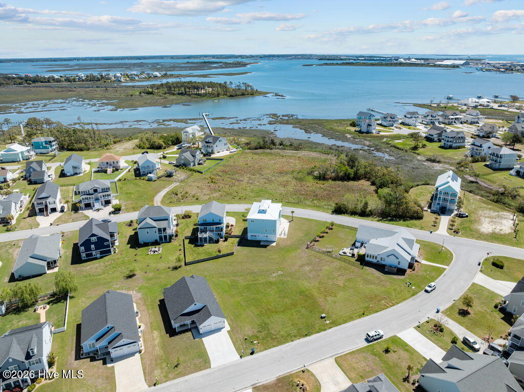 1302 Fathom Way Morehead City, NC 28557 - Photo 1 of 23 1302 is lot closest to the house on the corner. It has a direct water view if you build up!