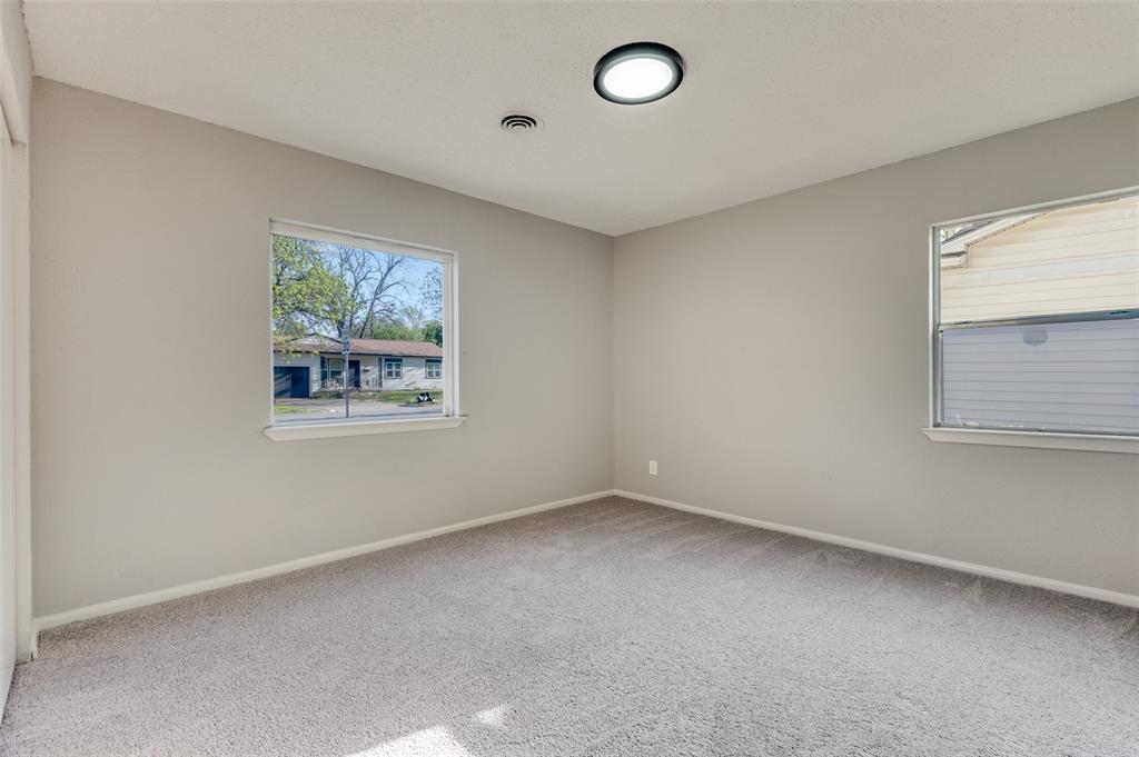 2320 Muret Street Irving, TX 75062 - Photo 8 of 12 an empty room with a window