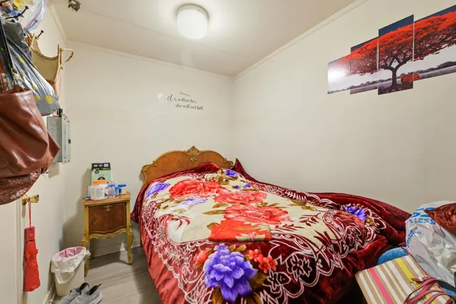 a bedroom with bed and a window