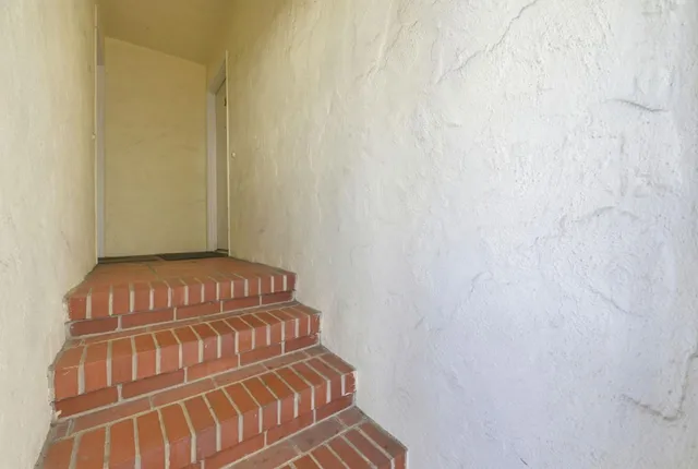 a kitchen with stainless steel appliances granite countertop a stove and a refrigerator
