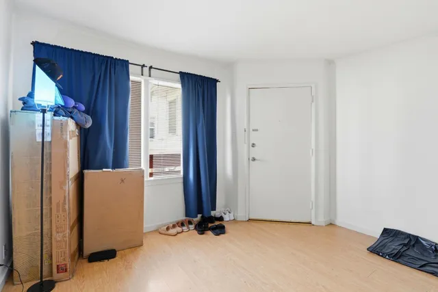 a view of balcony with wooden floor and fence