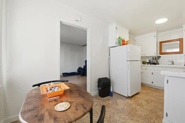 a room with furniture a rug and a window