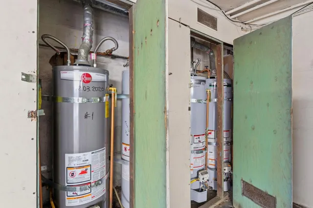 a kitchen filled with a refrigerator and a sink