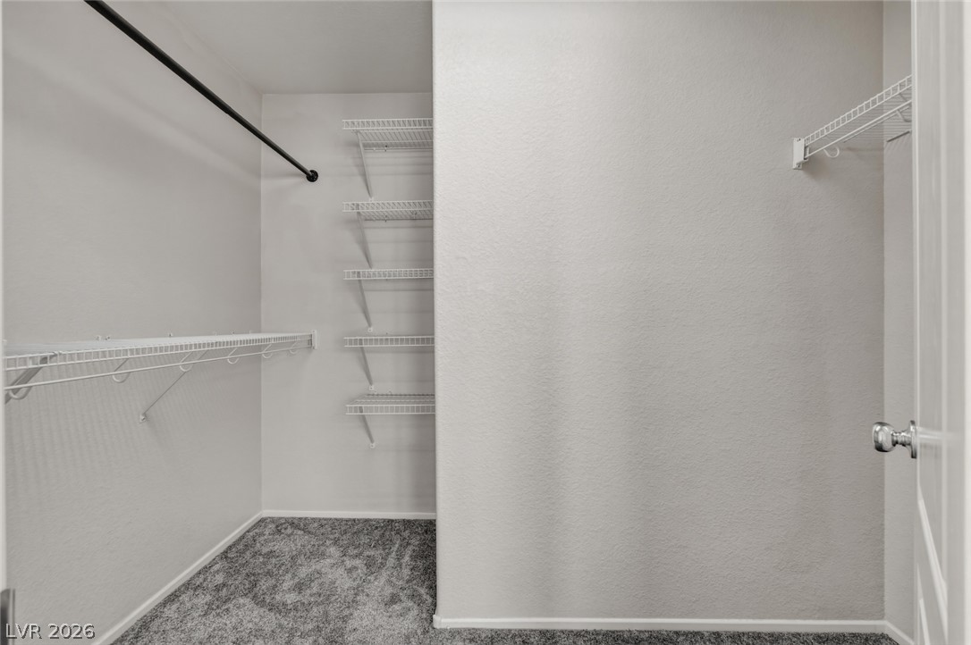 11159 Ranch Valley Street Las Vegas, NV 89179 - Photo 16 of 27 Functional closet space with abundant shelving provides ample storage solutions.