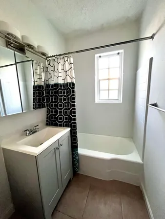 a bathroom with a sink and a bathtub