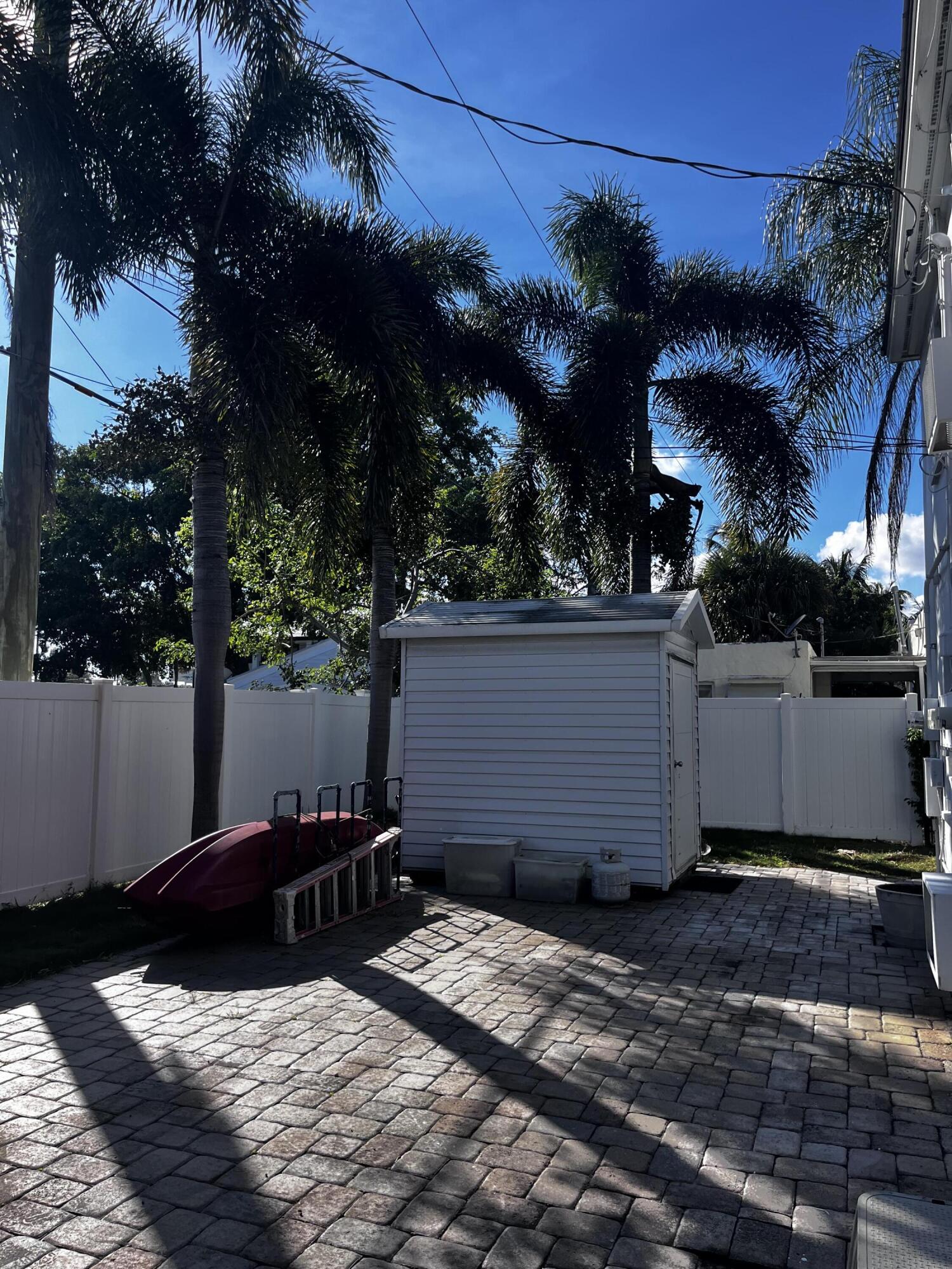 224 Conniston Road, Unit 3 West Palm Beach, FL 33405 - Photo 9 of 12 a view of a house with a yard