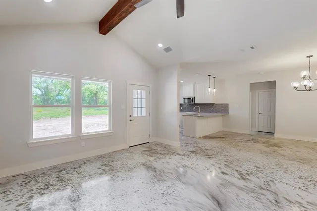 a view of a kitchen with a sink and cabinets