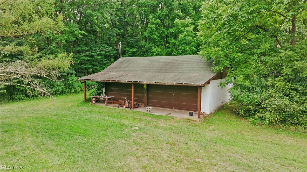 3555 Riverside Drive Northwest Massillon, OH 44647 - Photo 16 of 25 Garage with a yard