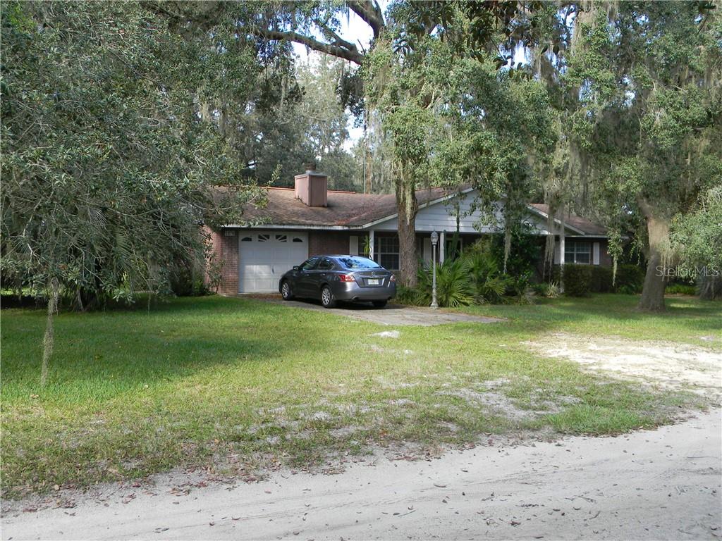 5978 Southwest 42nd Street Bushnell, FL 33513 - Photo 1 of 1 Front - Garage and Fireplace