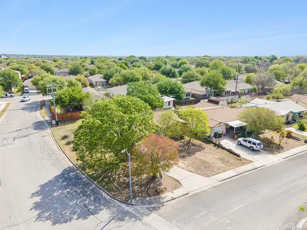 a view of a garden with an outdoor seating