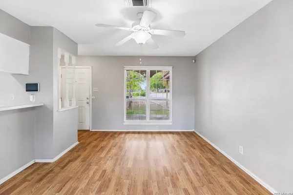 a view of room with window and hardwood floor