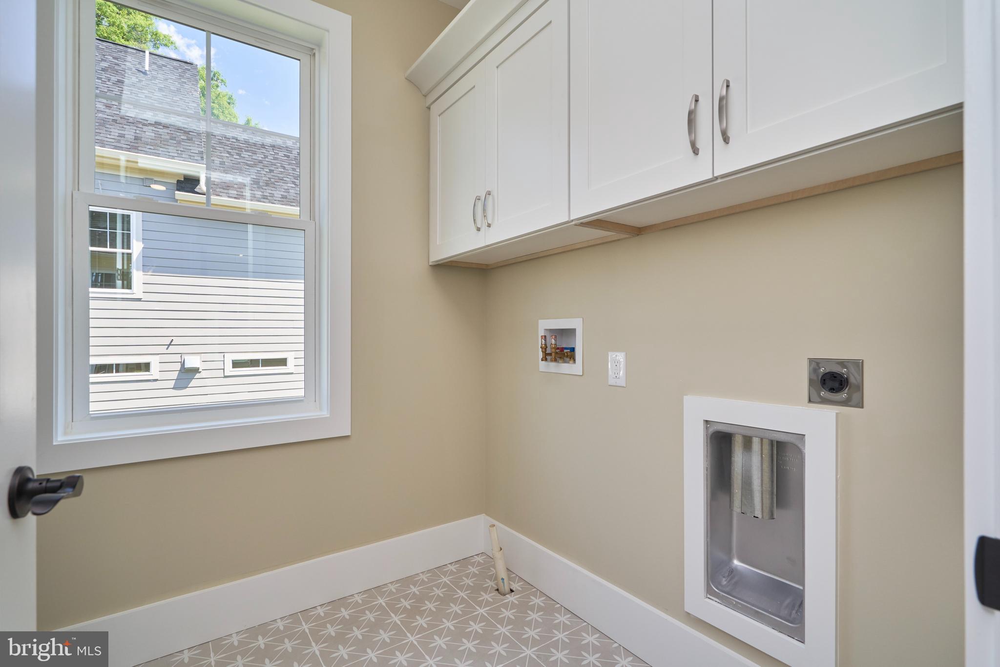 7019 Ridge Drive Alexandria, VA 22306 - Photo 33 of 67 Bdr level Laundry room w/ cabinets & tile floor