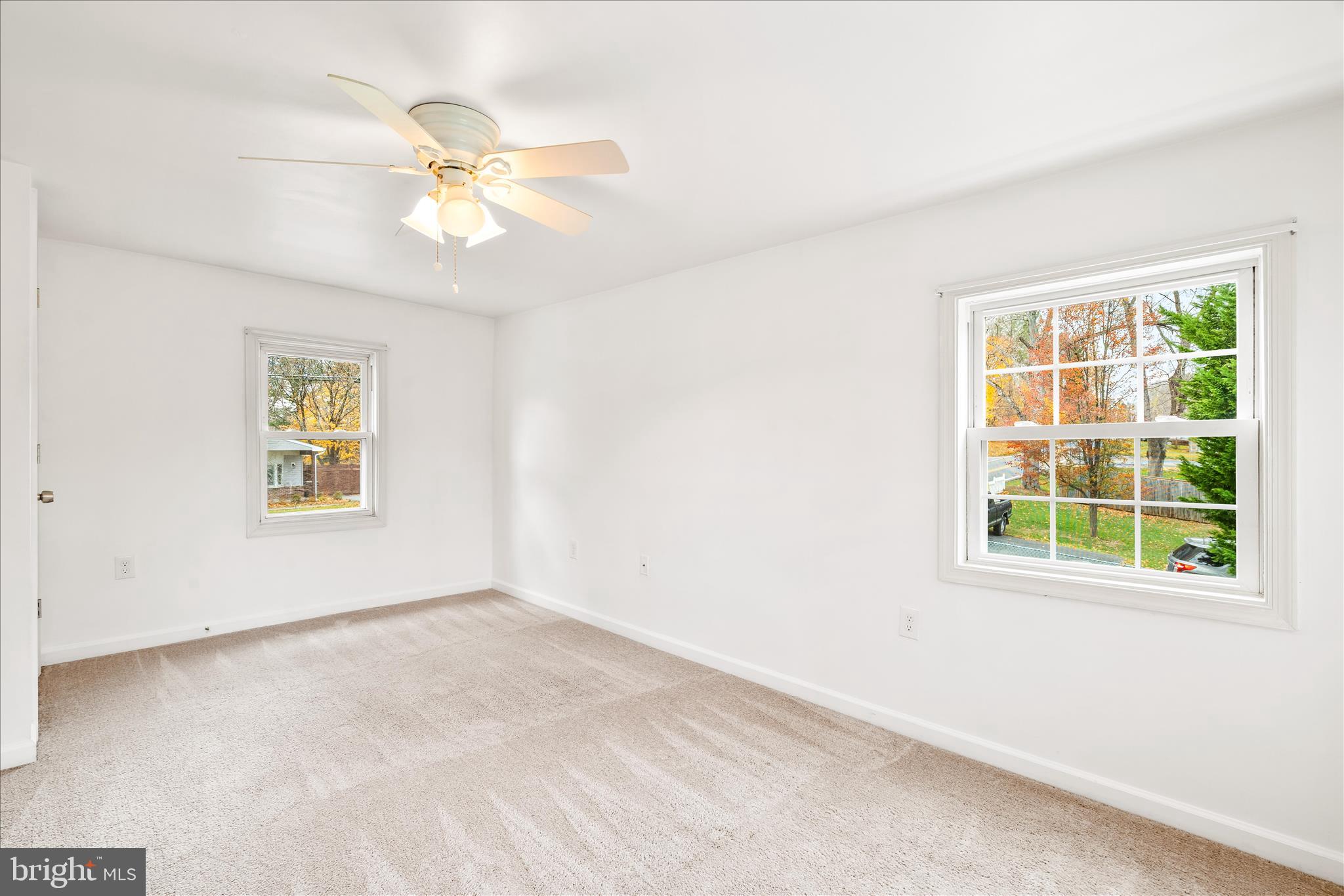 2060 Flag Marsh Road Mount Airy, MD 21771 - Photo 15 of 21 an empty room with windows and fan