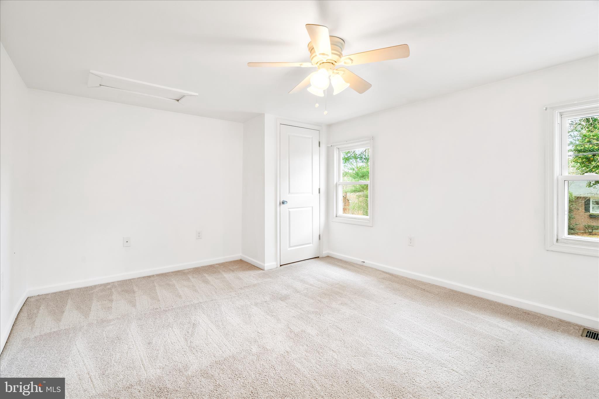 2060 Flag Marsh Road Mount Airy, MD 21771 - Photo 17 of 21 an empty room with windows and fan