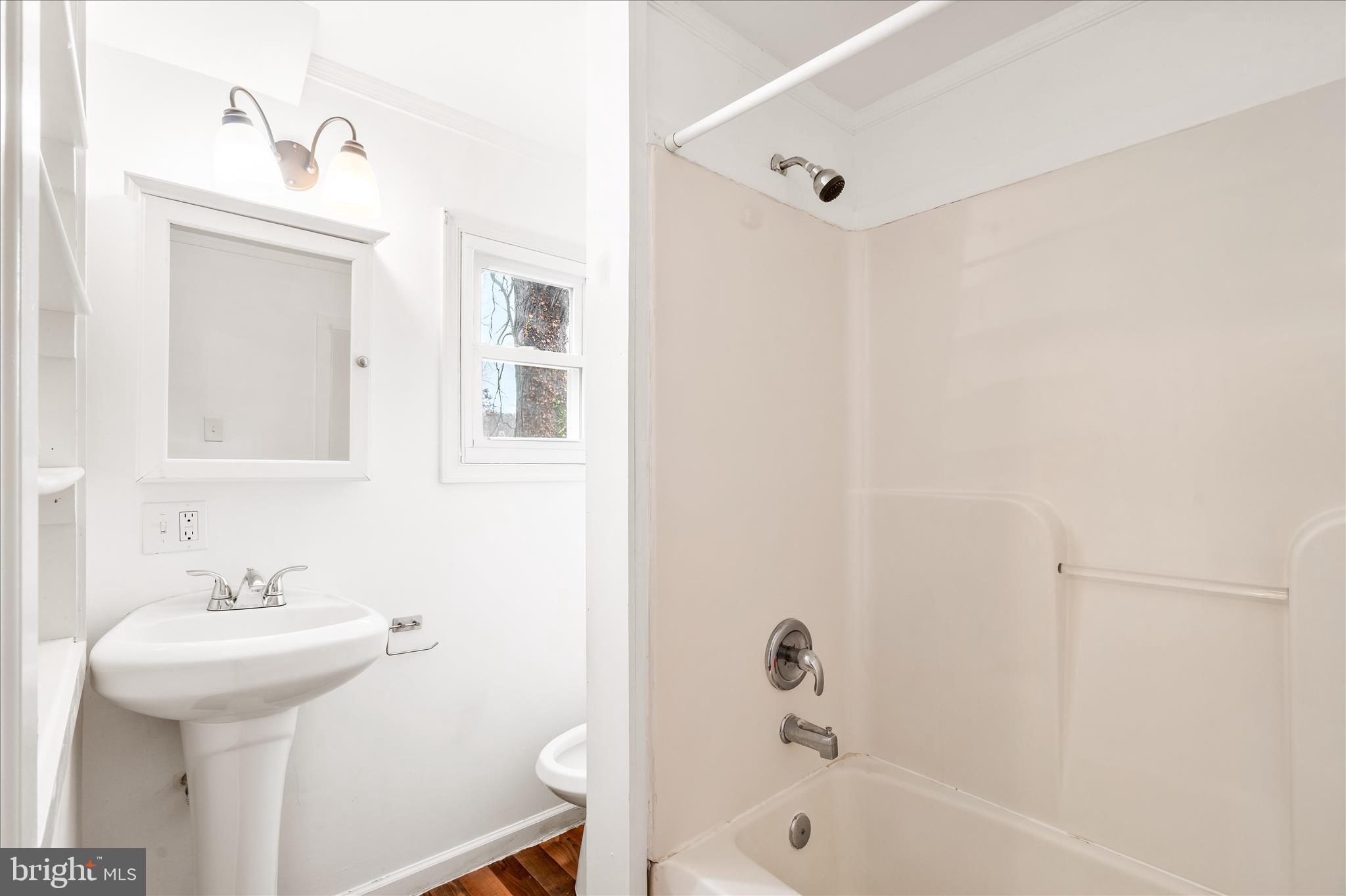 2060 Flag Marsh Road Mount Airy, MD 21771 - Photo 10 of 21 a bathroom with a sink a mirror and a bathtub