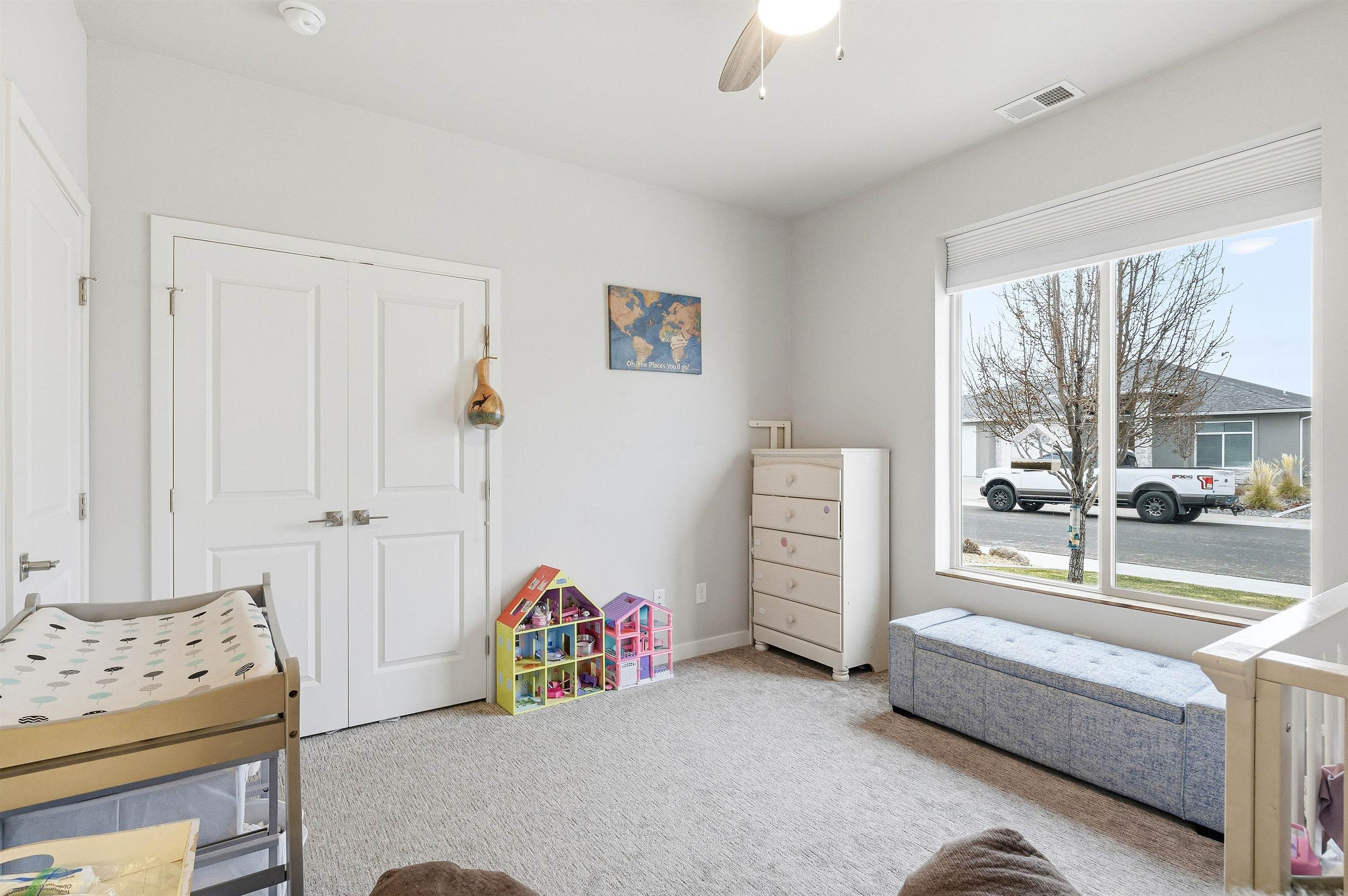 623 Thunder Ridge Drive Grand Junction, CO 81504 - Photo 15 of 40 a bedroom with furniture and a chandelier
