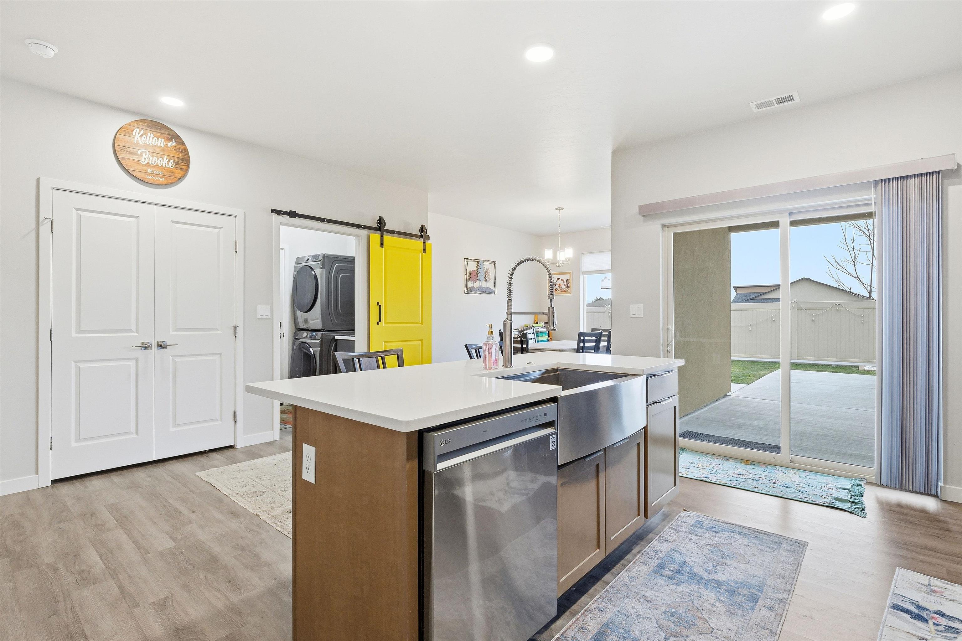 623 Thunder Ridge Drive Grand Junction, CO 81504 - Photo 21 of 40 a kitchen with a sink and a refrigerator