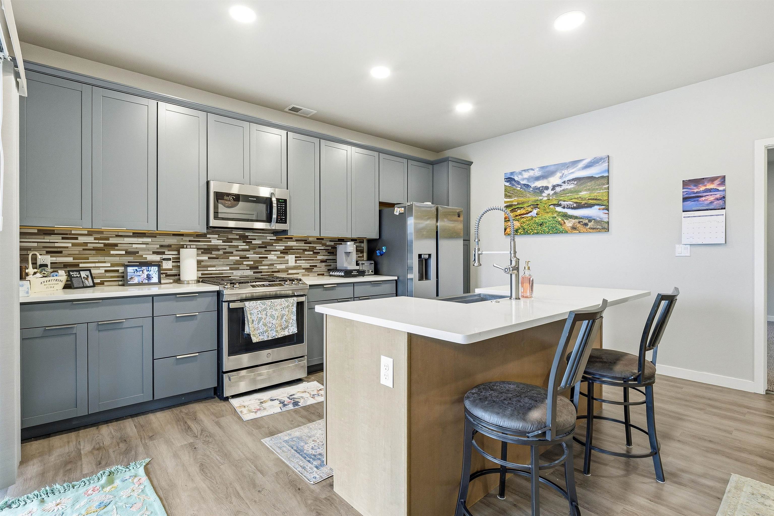 623 Thunder Ridge Drive Grand Junction, CO 81504 - Photo 23 of 40 a kitchen with a stove a sink cabinets and a refrigerator