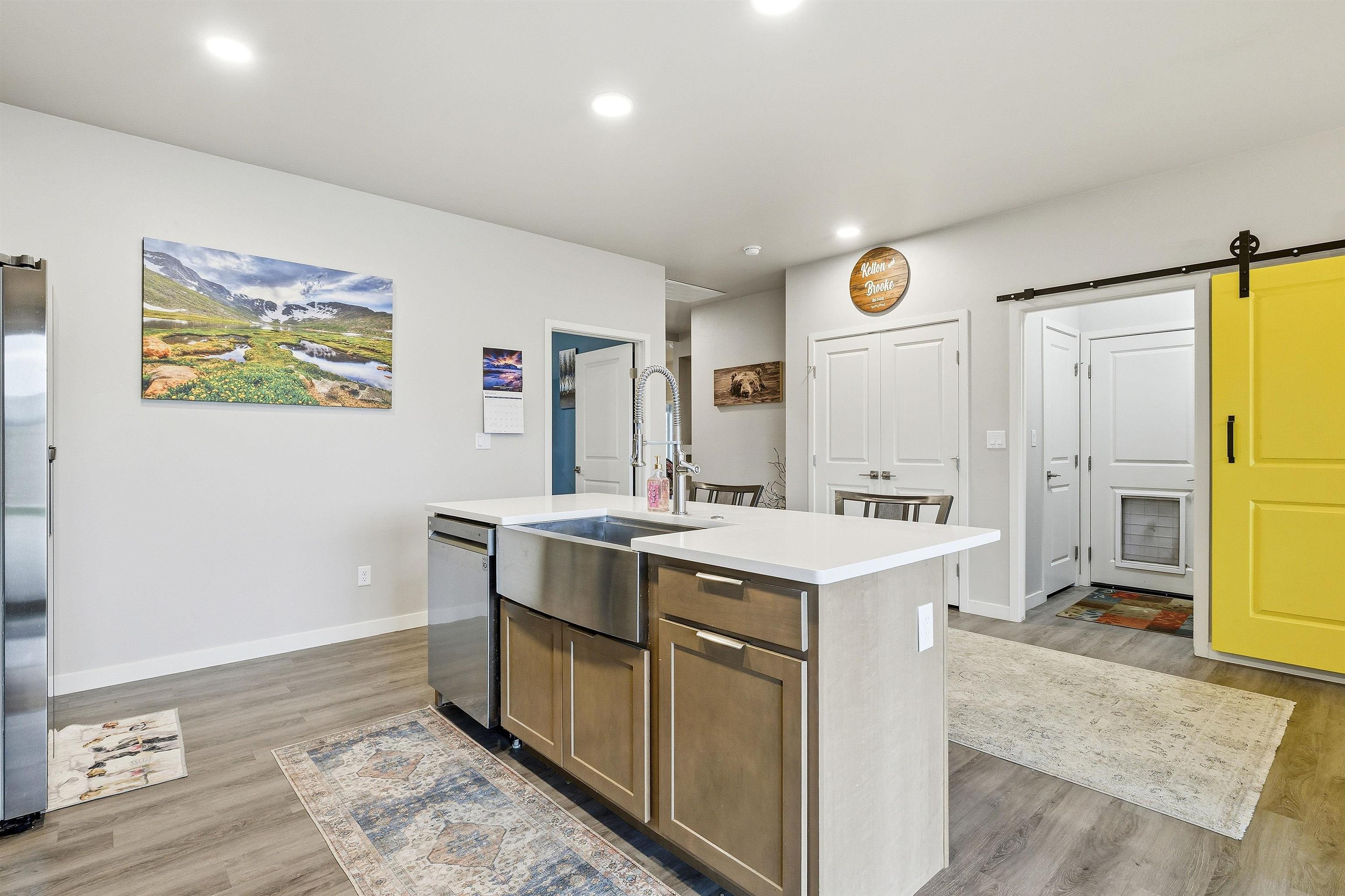 623 Thunder Ridge Drive Grand Junction, CO 81504 - Photo 24 of 40 a view of kitchen with cabinets and wooden floor