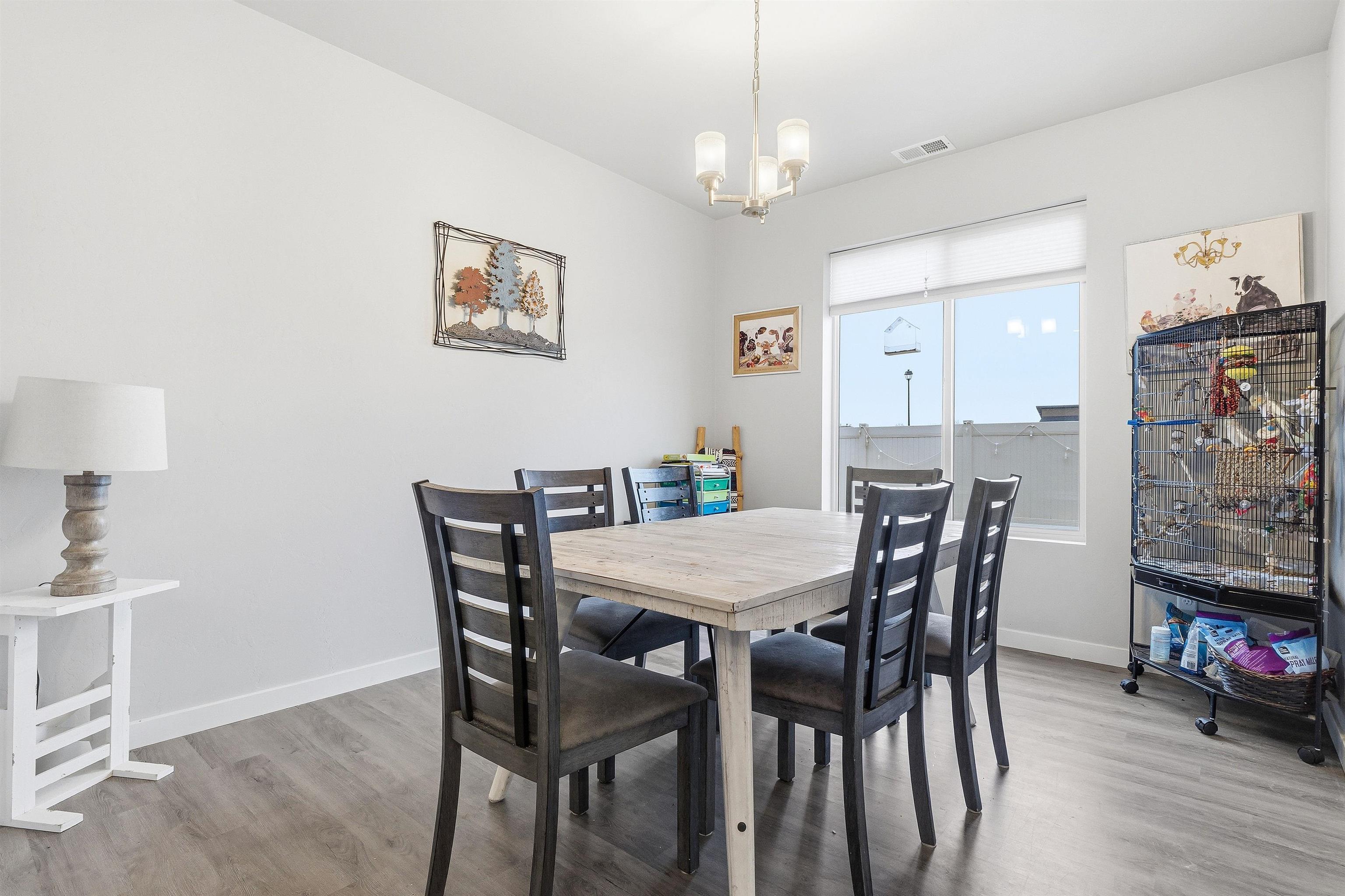 623 Thunder Ridge Drive Grand Junction, CO 81504 - Photo 25 of 40 a view of a dining room with furniture and wooden floor
