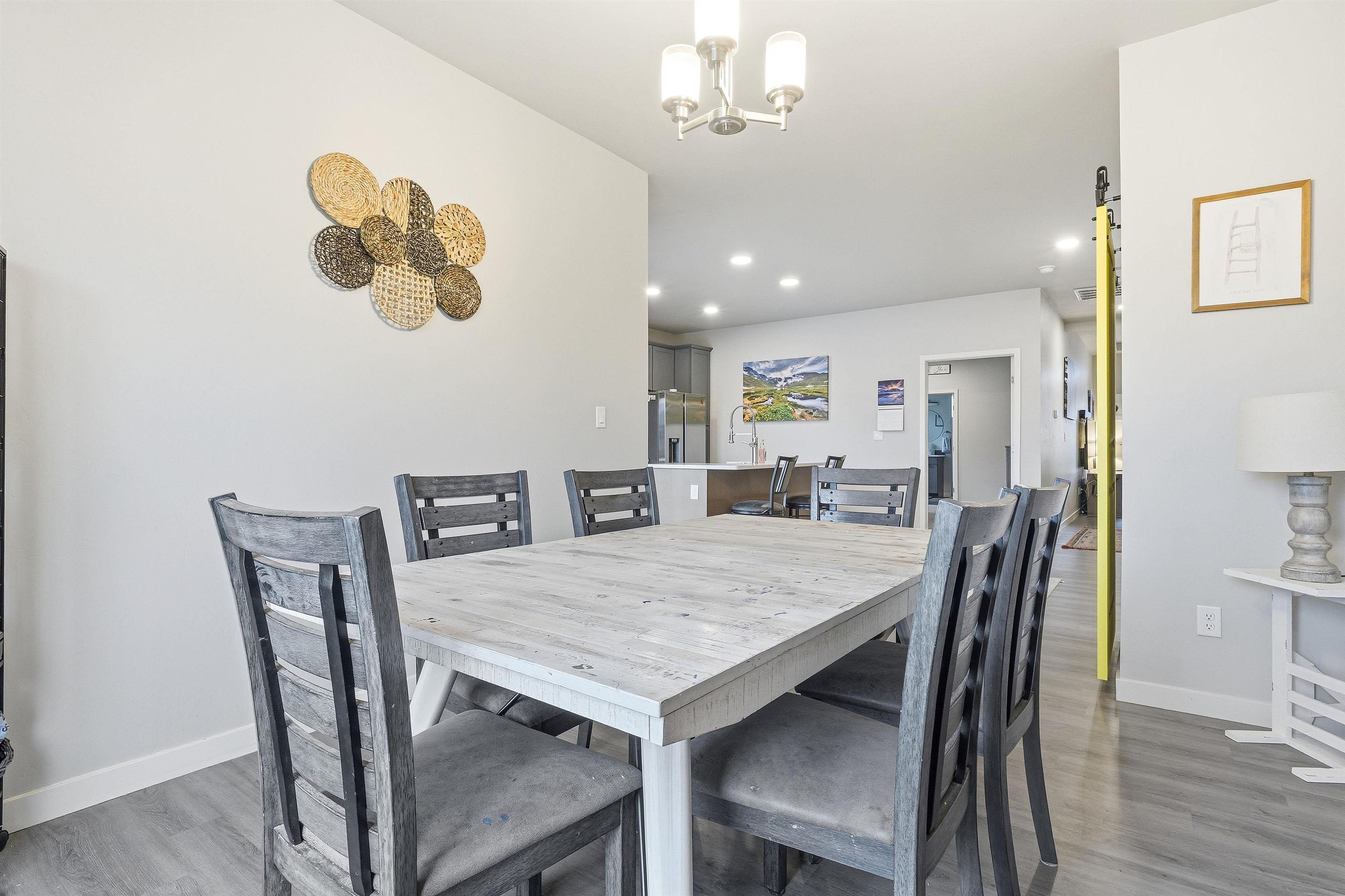 623 Thunder Ridge Drive Grand Junction, CO 81504 - Photo 26 of 40 a view of a dining room with furniture and wooden floor