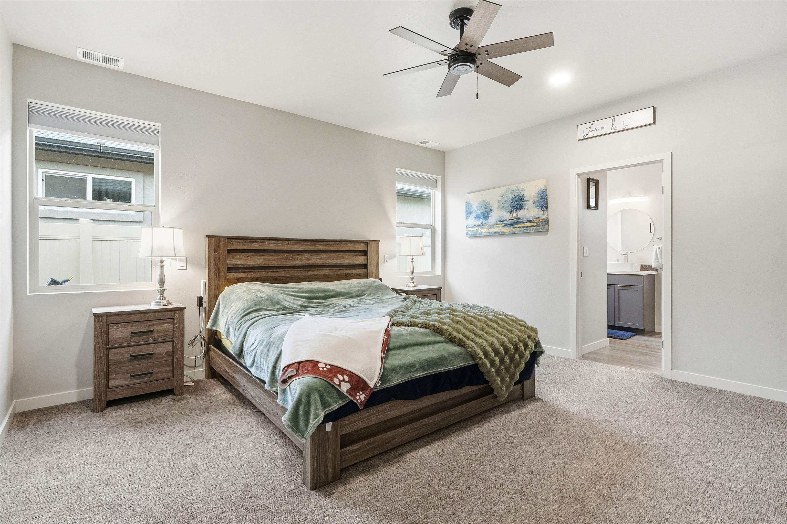 623 Thunder Ridge Drive Grand Junction, CO 81504 - Photo 28 of 40 a bedroom with a bed and cabinet