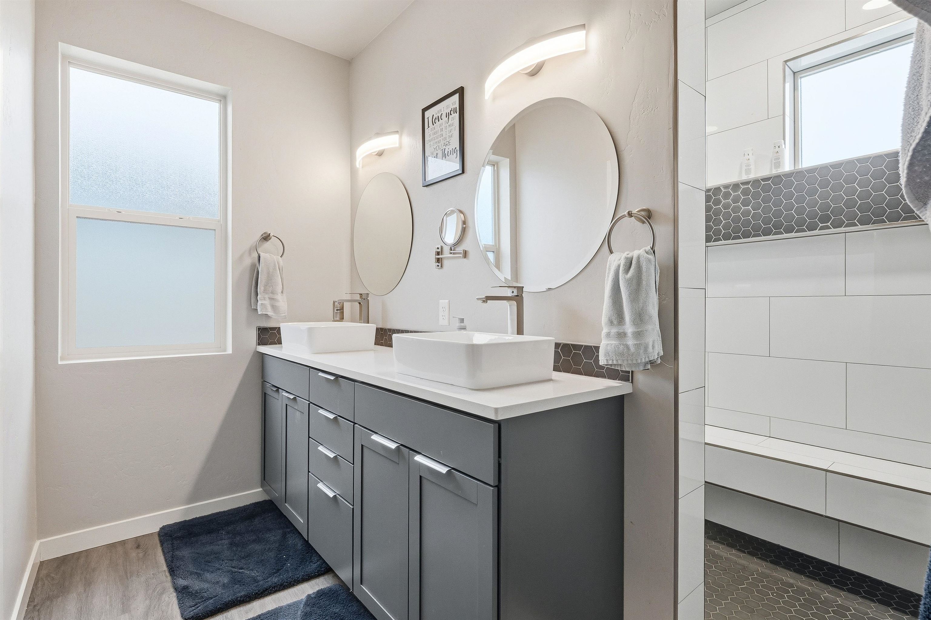 623 Thunder Ridge Drive Grand Junction, CO 81504 - Photo 30 of 40 a bathroom with a sink and a mirror