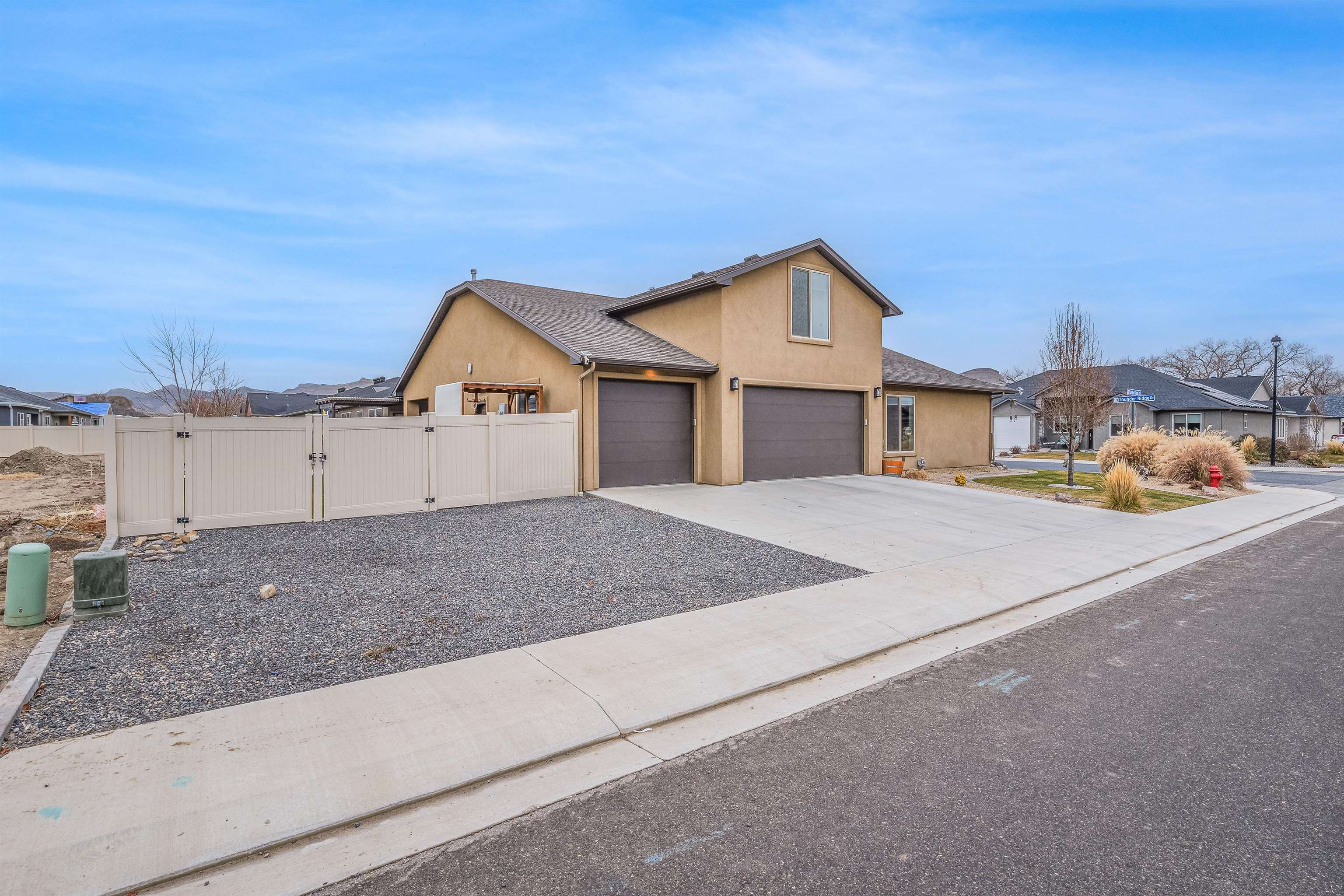 623 Thunder Ridge Drive Grand Junction, CO 81504 - Photo 3 of 40 a front view of a house with a yard and garage