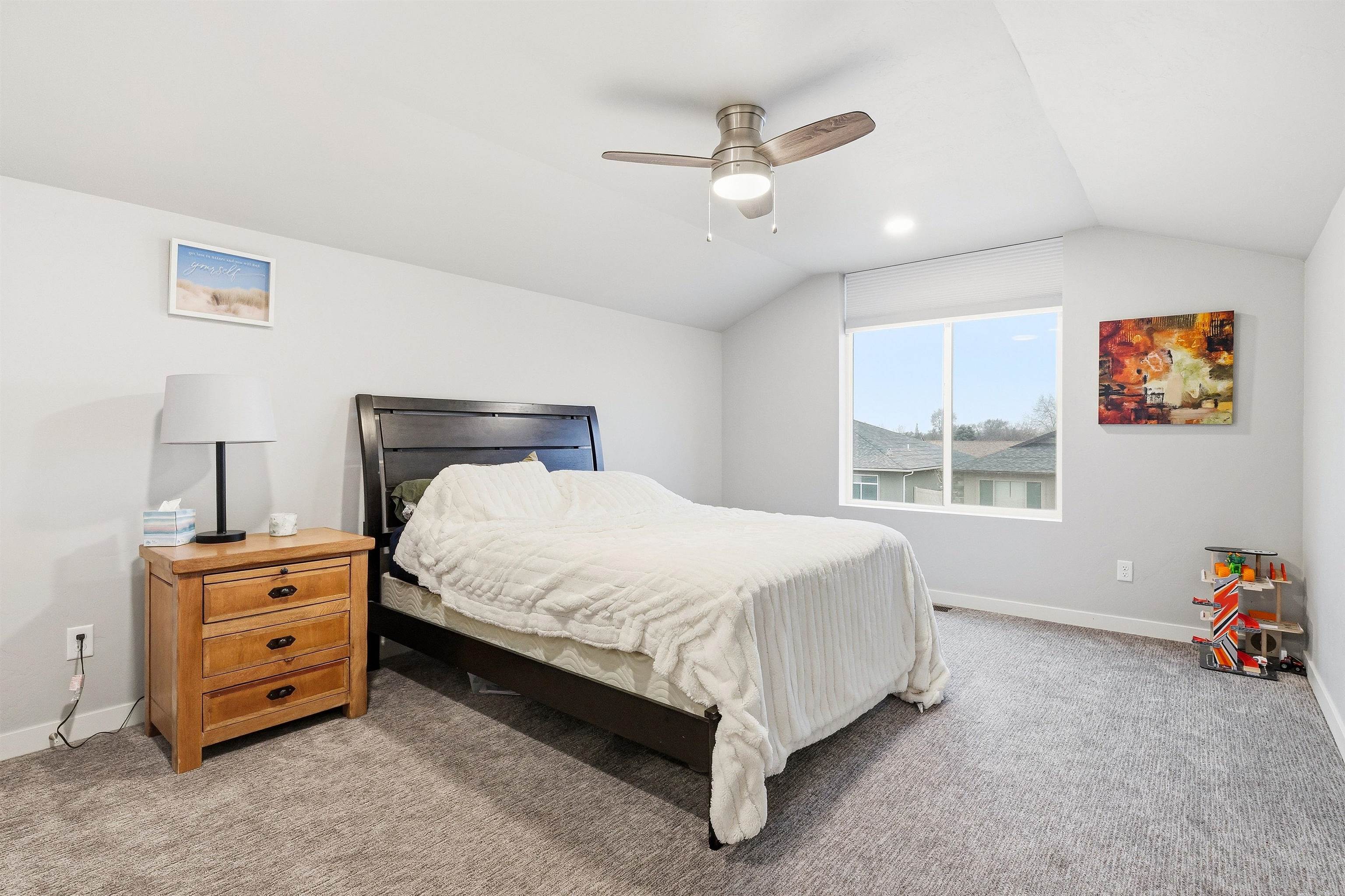 623 Thunder Ridge Drive Grand Junction, CO 81504 - Photo 33 of 40 a bed sitting in a bedroom next to a window