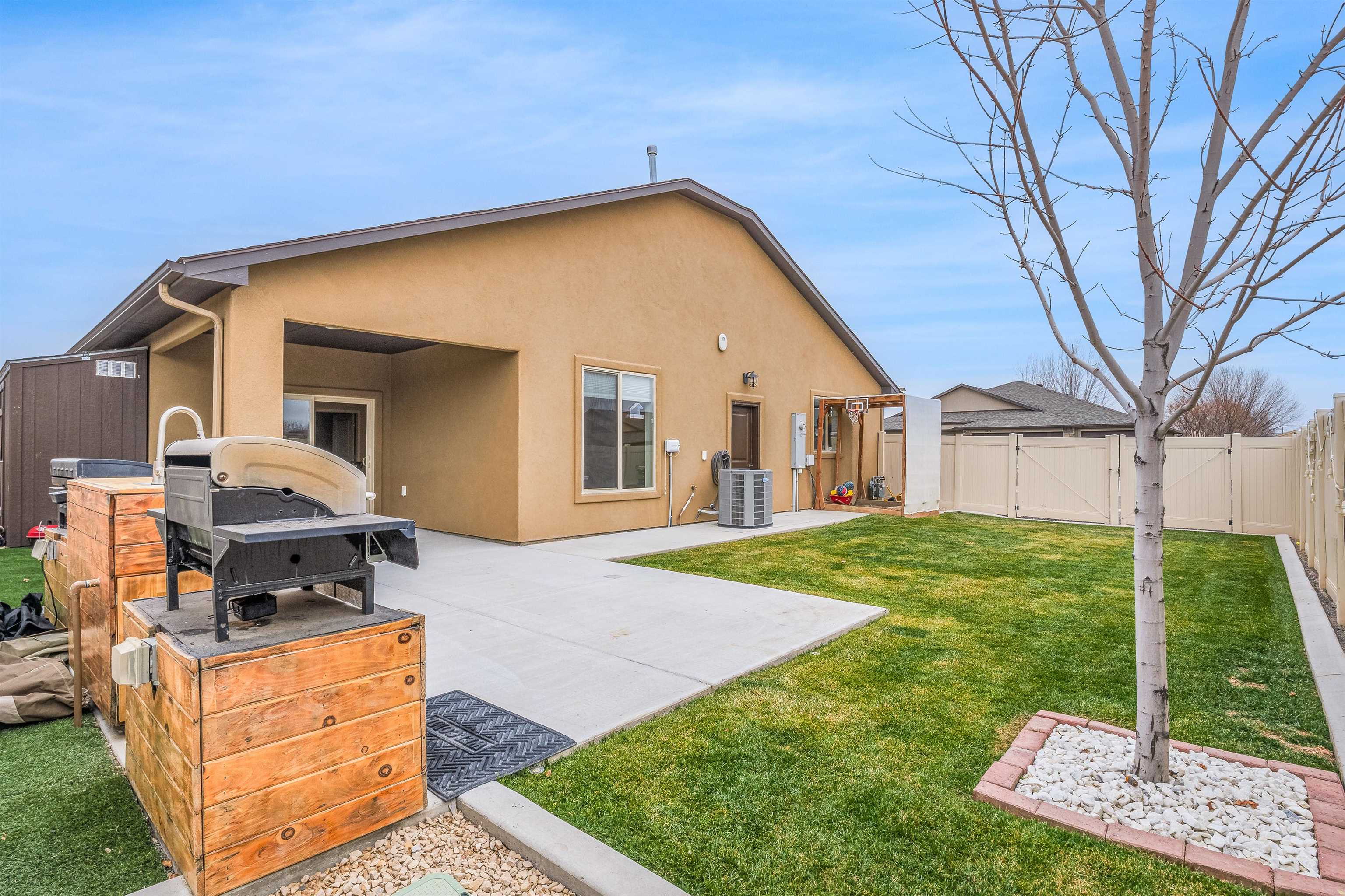 623 Thunder Ridge Drive Grand Junction, CO 81504 - Photo 36 of 40 a front view of a house with garden