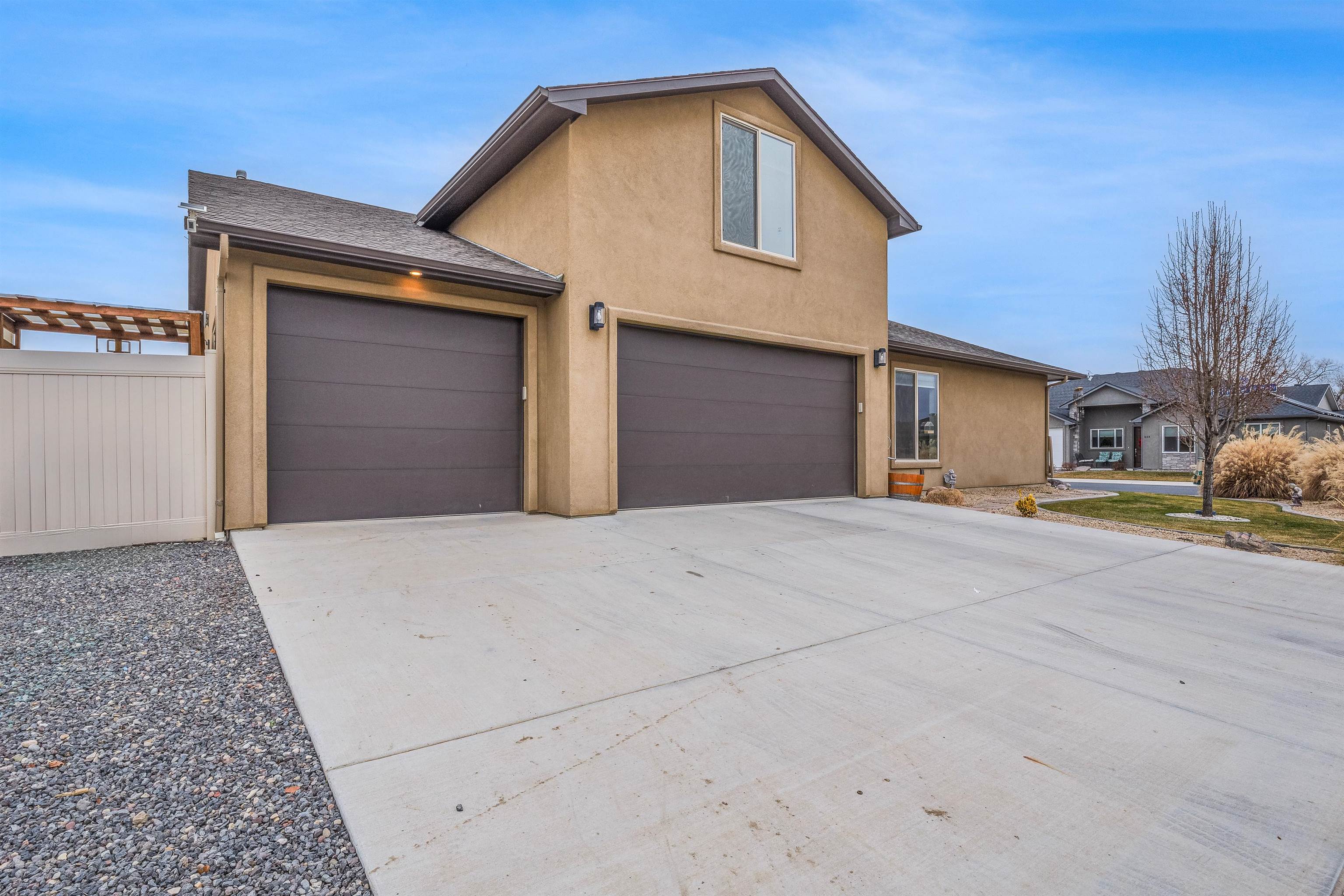 623 Thunder Ridge Drive Grand Junction, CO 81504 - Photo 40 of 40 a front view of a house with a yard and garage