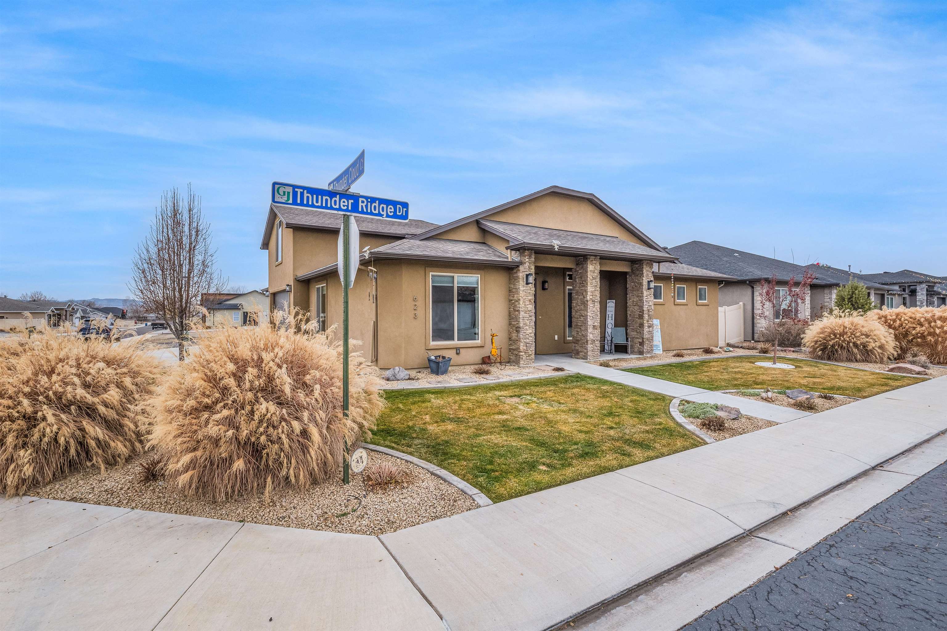 623 Thunder Ridge Drive Grand Junction, CO 81504 - Photo 5 of 40 a front view of a house with garden