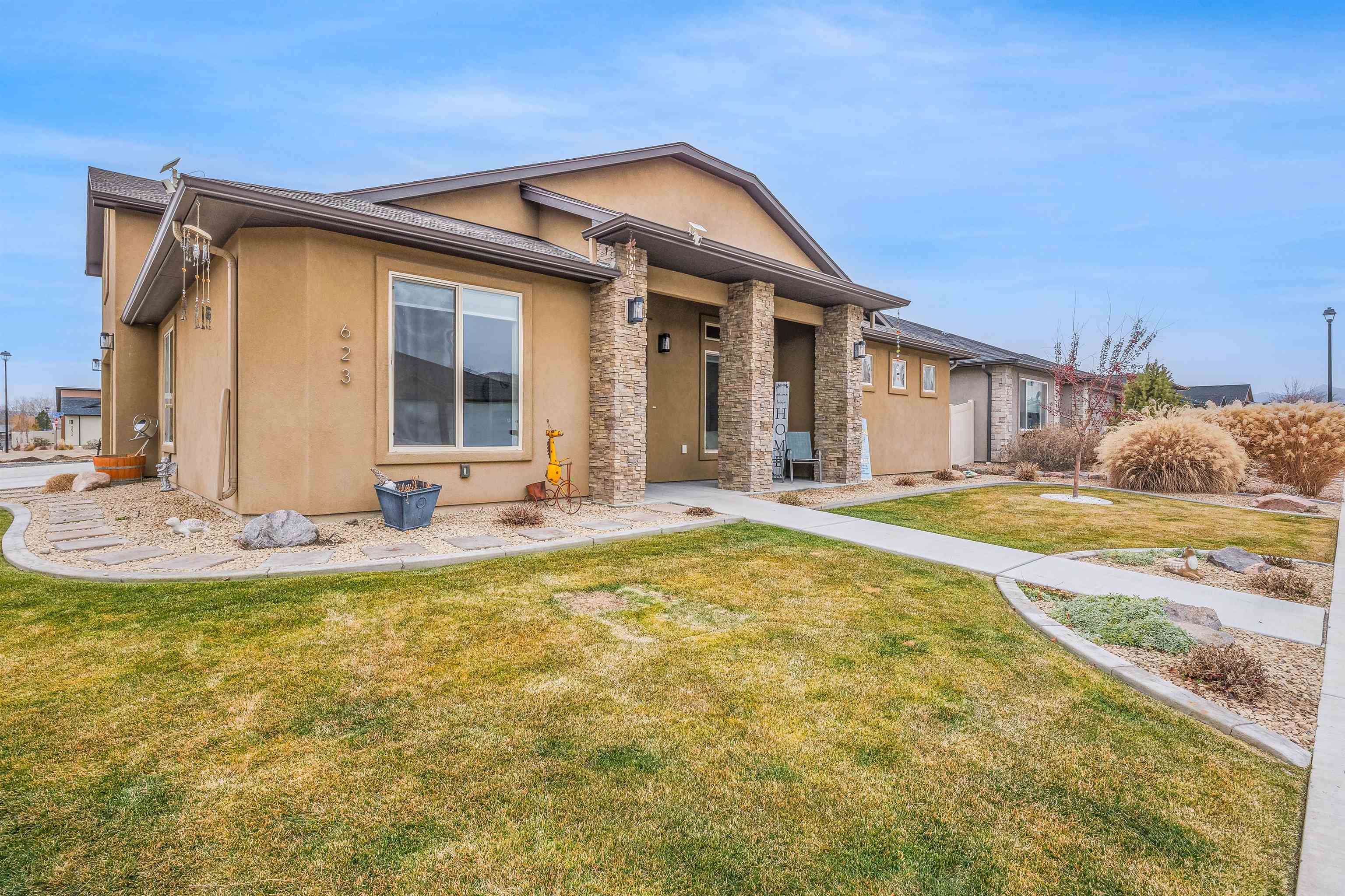 623 Thunder Ridge Drive Grand Junction, CO 81504 - Photo 6 of 40 a view of a house with swimming pool and porch