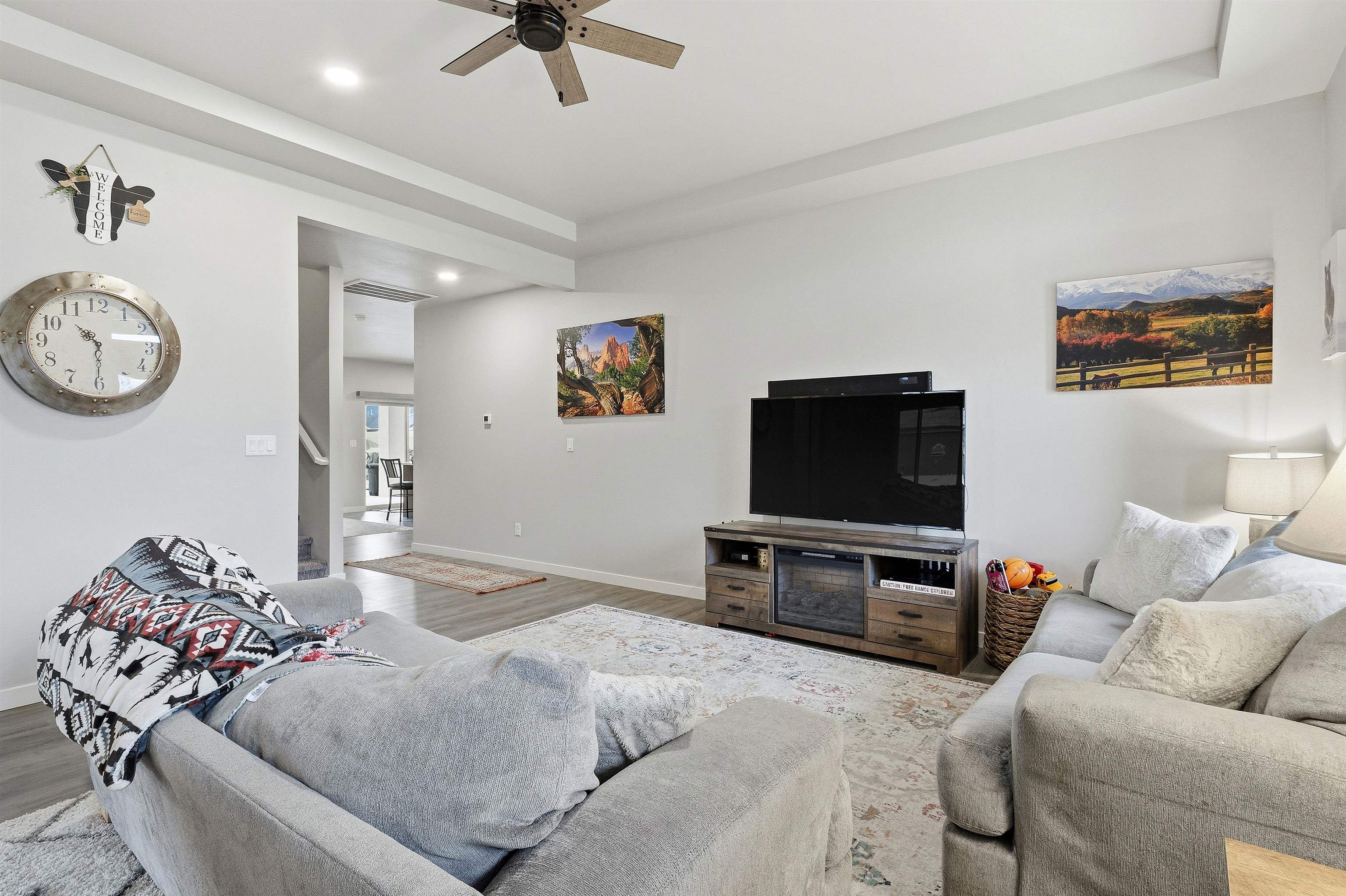 623 Thunder Ridge Drive Grand Junction, CO 81504 - Photo 9 of 40 a living room with furniture and a flat screen tv