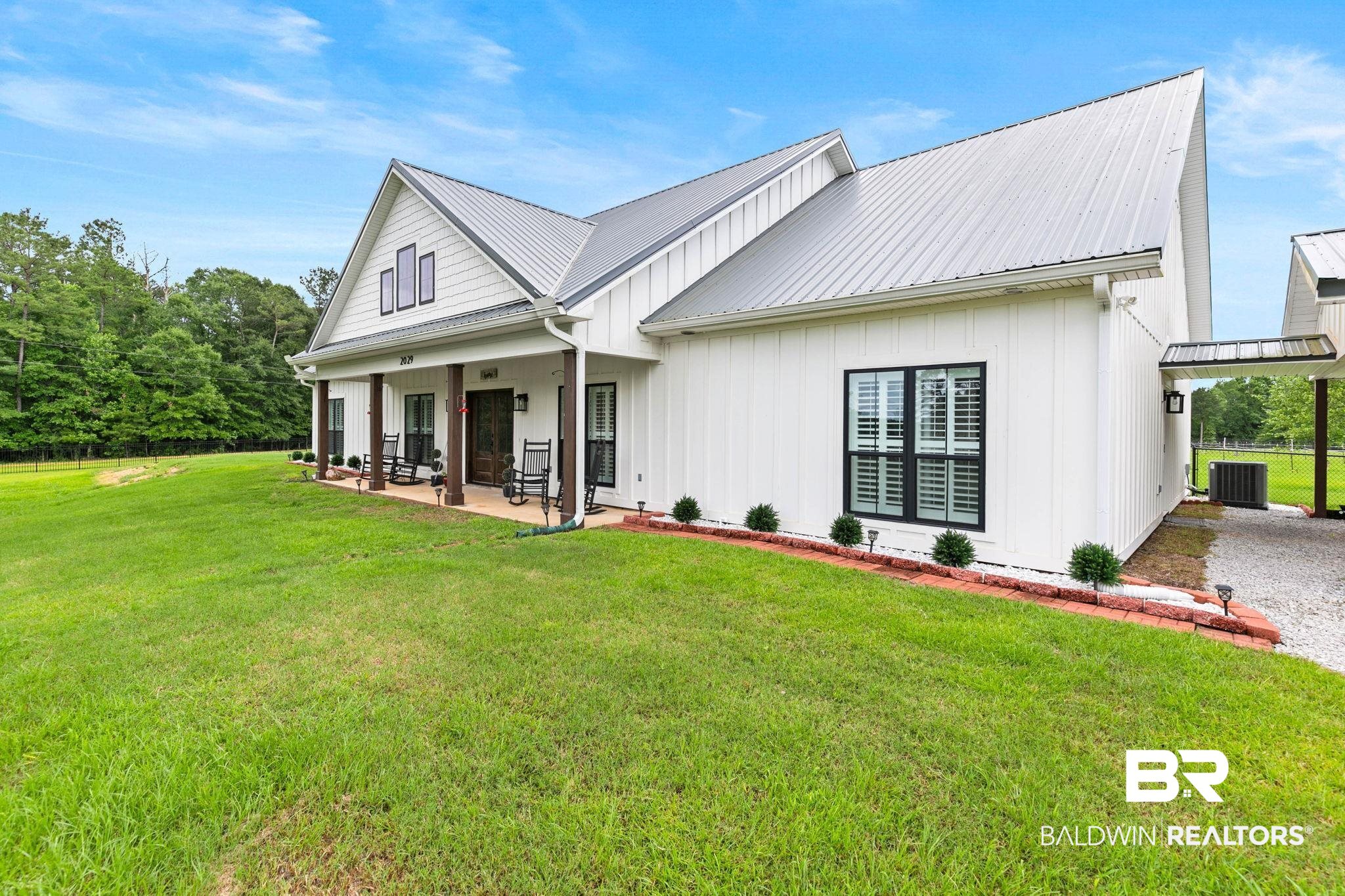2029 George Lee Road Repton, AL 36475 - Photo 6 of 58 Modern farmhouse exterior with white board-and-batten siding