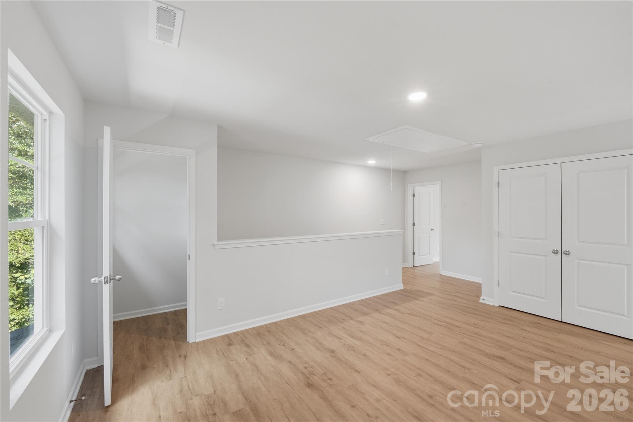 242 Landers Chapel Road Lincolnton, NC 28092 - Photo 20 of 33 wooden floor in an empty room with a window