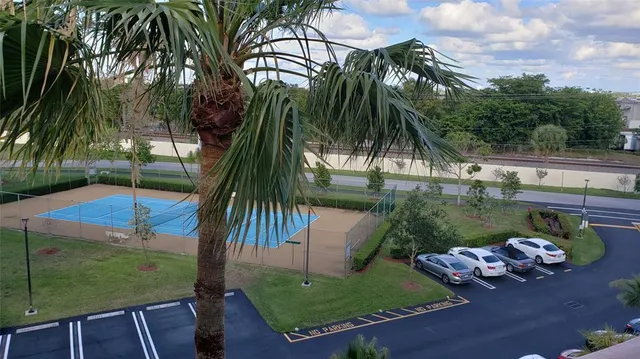 a couple of cars parked in front of a building