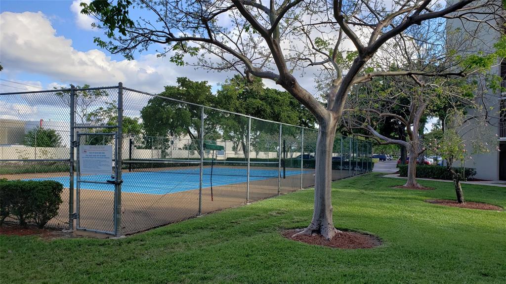 2216 North Cypress Bend Drive, Unit 504 Pompano Beach, FL 33069 - Photo 19 of 33 a view of a park with basketball court
