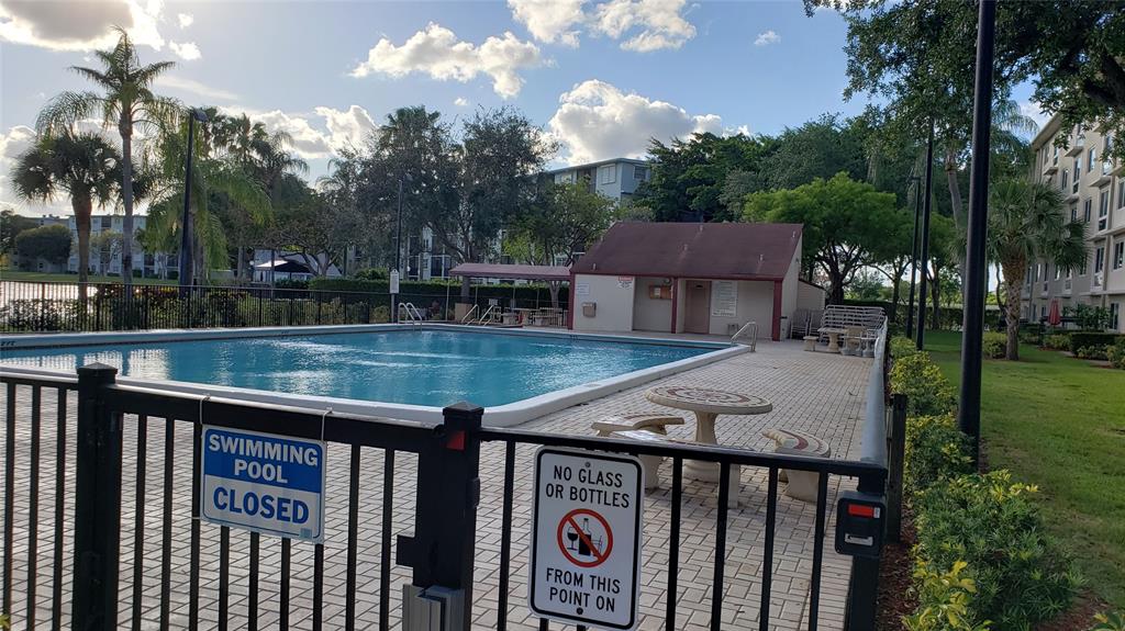 2216 North Cypress Bend Drive, Unit 504 Pompano Beach, FL 33069 - Photo 21 of 33 a view of backyard with deck and outdoor seating