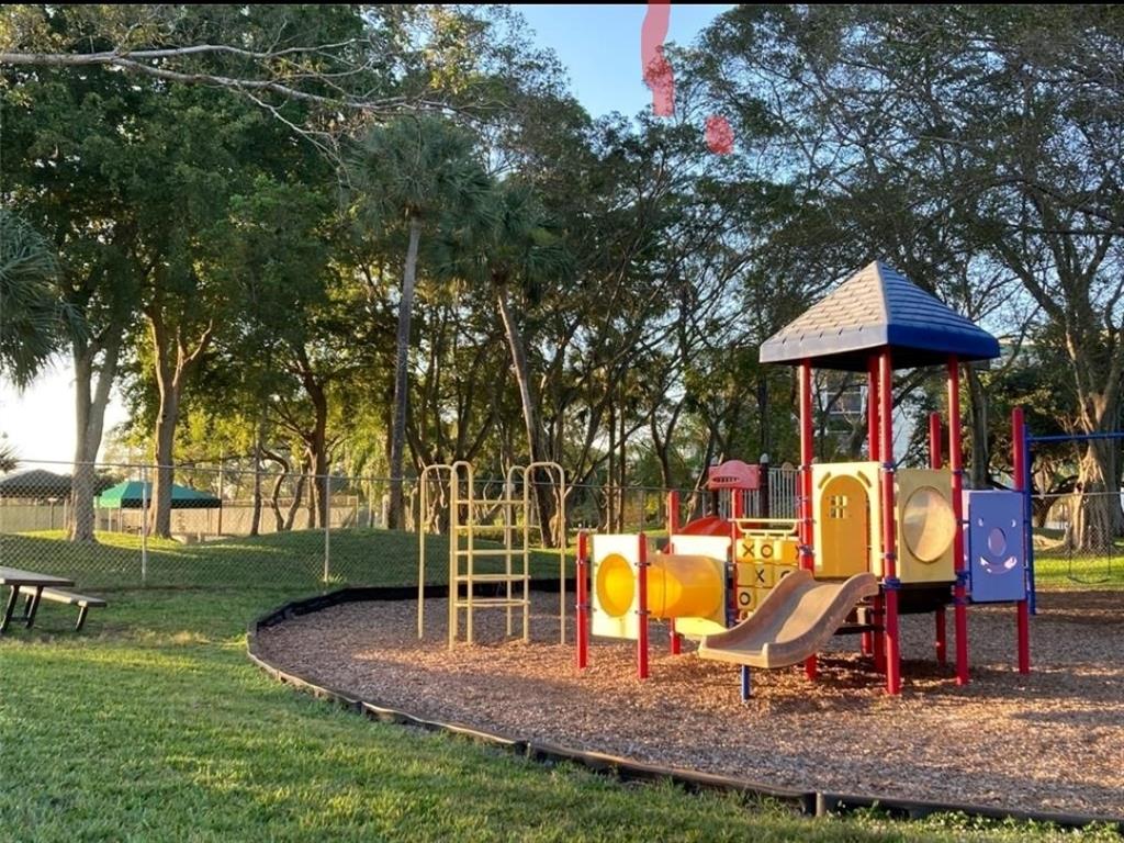 2216 North Cypress Bend Drive, Unit 504 Pompano Beach, FL 33069 - Photo 26 of 33 a view of outdoor space yard deck and lake view